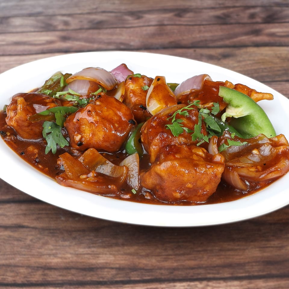Bombay South's Indian dish with paneer, onions, and green peppers in a rich brown sauce.