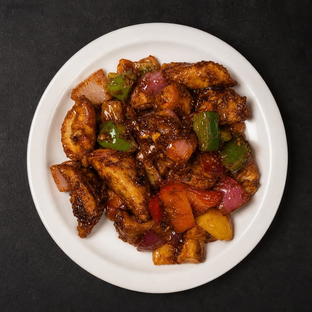 Chili Veg or Chicken Momos.