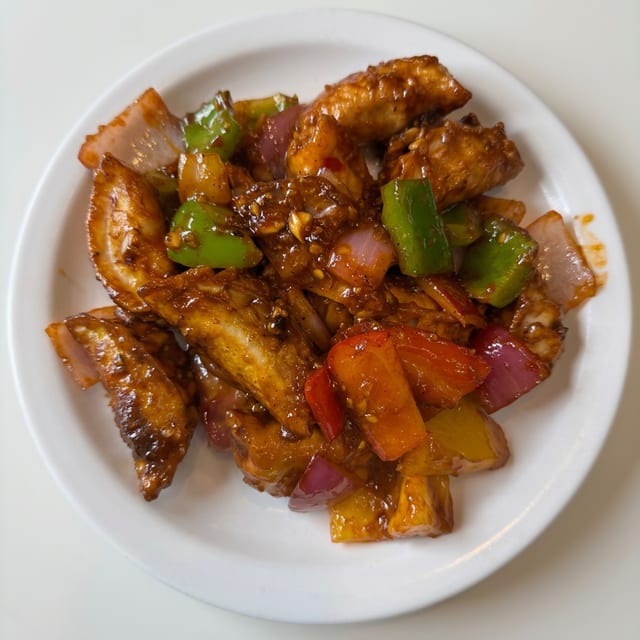 Chili Veg or Chicken Momos.
